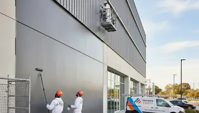 Professional commercial painters working on Burlington VT office exterior repainting